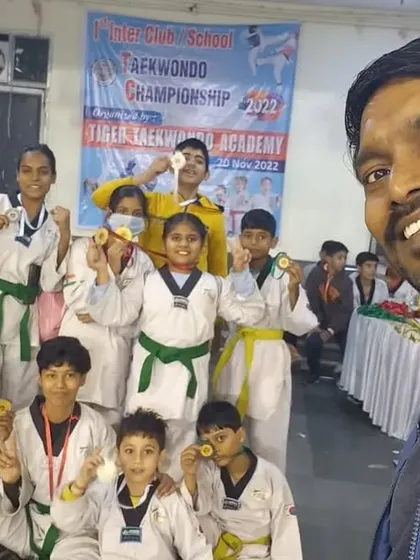 A selfie with the team after a successful day at the Tiger Taekwondo Academy championship. Unity brings victory.