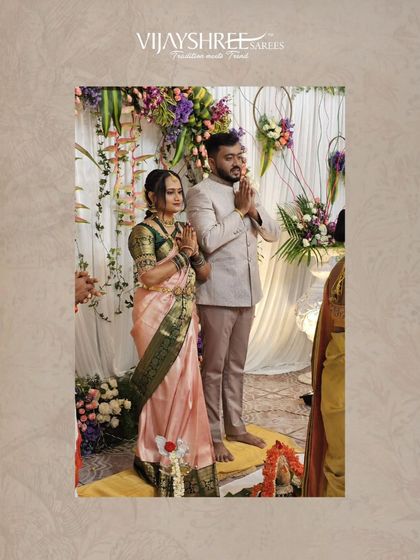 Rakshitha and her partner during their engagement ceremony. The saree's classic design and rich border stand out, making her look effortlessly elegant.