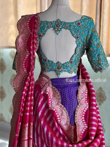 Another look at this unique bridal half-saree, showcasing the beautiful drape of the striped dupatta against the richly detailed turquoise blouse.