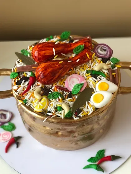 Yes, that's a cake! I had so much fun creating this hyper-realistic Biryani Handi cake. Every detail, from the rice grains to the chicken legs and spices, is completely edible.