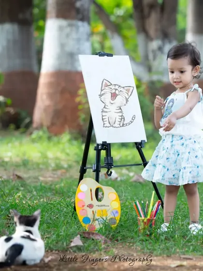Our surprise guest, a friendly cat, sat perfectly for this little artist.