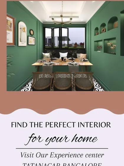 An ethnic and elegant dining area design, featuring a bold green wall, intricate patterns, and warm wood tones for a unique and inviting atmosphere.