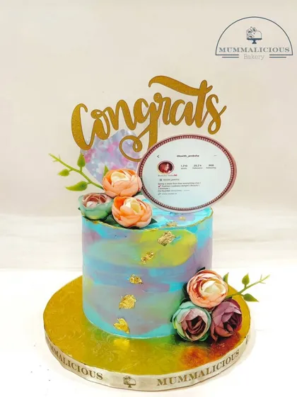 A cake to celebrate a social media milestone. This watercolour-effect cake with fresh flowers was ordered to celebrate a friend hitting 26.2k followers, showing that any achievement is worth celebrating with cake.