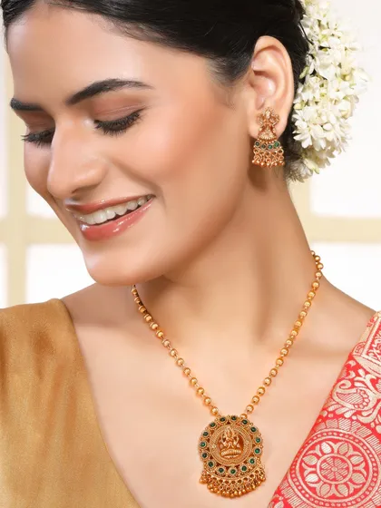 A smiling model showcases a traditional temple jewellery necklace. The happy and authentic expression makes the brand feel more relatable, perfect for lifestyle-oriented campaigns.