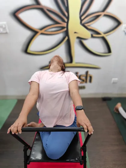 This is a back-bending chair, a specialized prop we use to help students safely open their thoracic spine. It provides excellent support for the back.