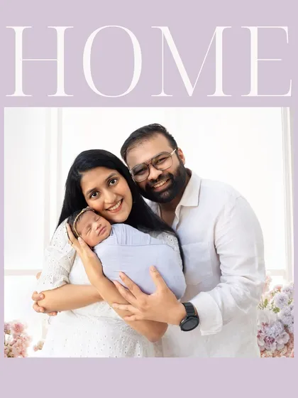This portrait of a smiling family holding their newborn perfectly captures the feeling of 'Home'. It's a beautiful memory to display for years to come.