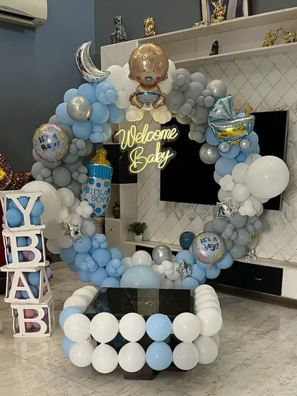 The full living room setup for the "Welcome Baby" boy party, showing how the decor fills the space.