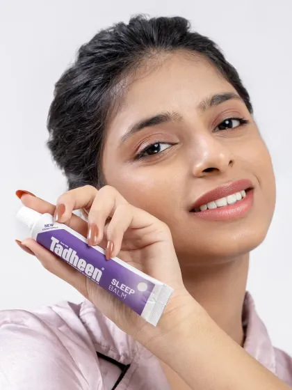 A clean and simple beauty shot for the Tadheen campaign. The model holds the product close to her face, with a fresh and natural look that speaks to wellness.