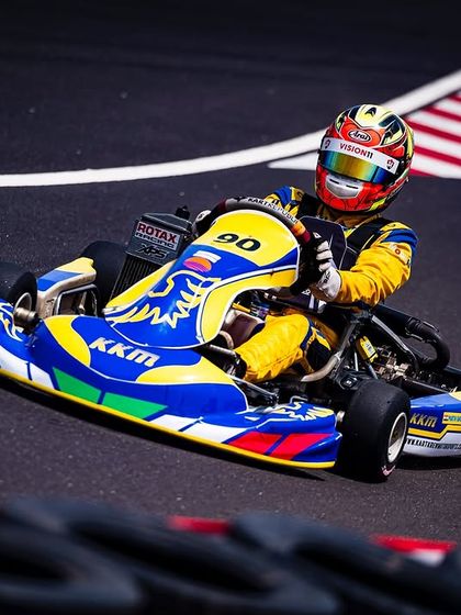 Our driver in the number 90 kart, taking a corner with speed and precision.