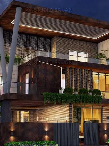 A night view of the Varanasi villa, where lighting emphasizes the texture of the materials and the building's strong, angular forms. The design feels both powerful and deeply connected to its site.