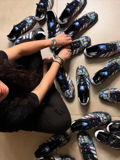 An overhead shot of the nine pairs of custom Adidas Sambas I painted for a client. This view really shows the controlled chaos of the splatter art style across the entire collection.