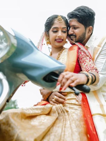 A fun and modern twist on wedding photos. We love taking creative portraits of the couple after the ceremony, like this cute shot on a scooter.