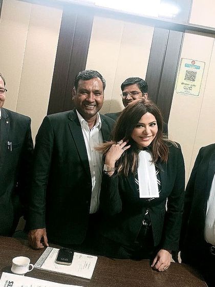 In my advocate attire, discussing important bar matters with my colleagues in Faridabad.