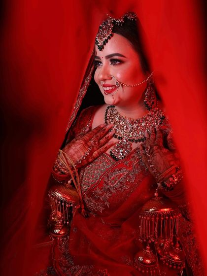 Another beautiful angle of my red bride, showing how the makeup and jewellery come together to create a cohesive and royal look.