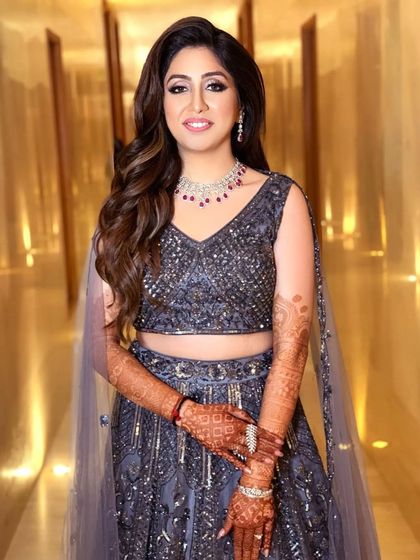 The perfect blend of glamour and grace for an engagement. This look features soft smokey eyes and a dewy finish, making the bride-to-be look absolutely radiant.