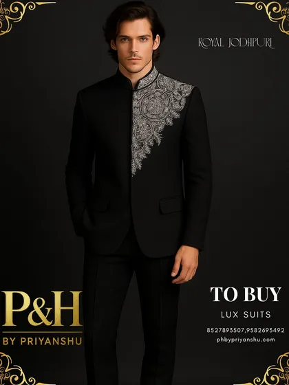 Power and elegance converge in this royal black Jodhpuri suit. The deep black fabric provides a dramatic canvas for the shimmering silver hand-embroidery that adorns the collar and front, creating a look of pure, unadulterated luxury for any formal occasion.