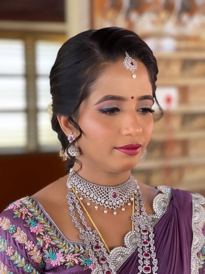 Nayan's reception look is a beautiful blend of modern and traditional. She wears a unique half-saree style lehenga, which I complemented with soft glam makeup and an elegant updo.