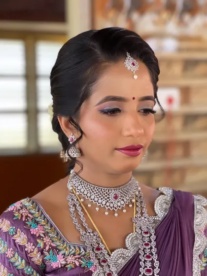 Nayan's reception look is a beautiful blend of modern and traditional. She wears a unique half-saree style lehenga, which I complemented with soft glam makeup and an elegant updo.