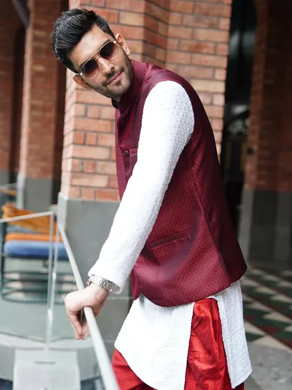 A stylish pose that shows off the details of my ethnic outfit. I believe in making a statement with my presence.