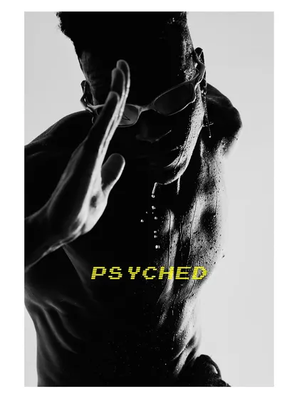 A high-contrast, graphic male portrait. Shot against the bright sky, the model becomes a silhouette, with water droplets catching the light. This is a purely visual, abstract take on a fitness portrait.