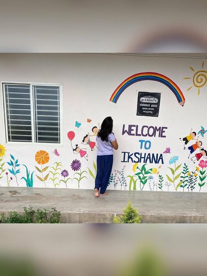 We had so much fun beautifying the walls of Ikshana Patashala, a preschool. We painted several murals, including a welcome wall with kids and flowers, and a large "tree of knowledge" doodle, to create a playful and inspiring environment.