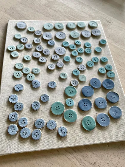 This is a story about a custom commission for ceramic buttons. A client needed unique, handmade buttons for a hand-stitched outfit, and we worked together to create 66 custom pieces in various sizes and colors.