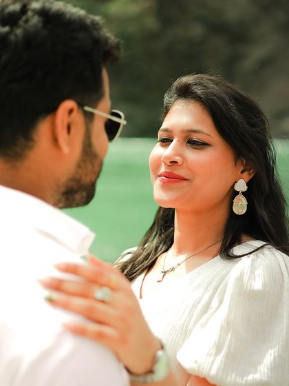 A lovely candid shot capturing the bride's adoring gaze during her Rishikesh pre-wedding shoot.