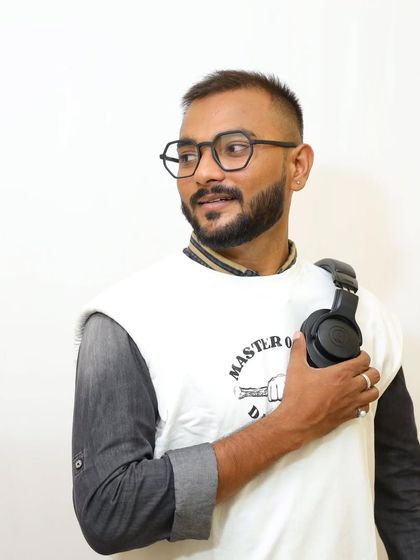 A studio-style shot with my headphones. This represents the artist side of my work, always connected to the music, whether I'm in the club or not.