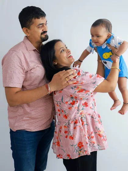 Pure happiness! Lifting your baby up in the air always brings out the biggest smiles and giggles. It's a candid moment of pure joy that I love to capture.