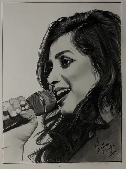 A pencil sketch of the melodious singer Shreya Ghoshal. This portrait captures her in her element, sharing her voice with the world.