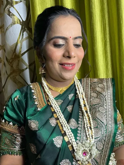 A special look for a Dohale Jevan (baby shower). The makeup is soft and glowing, celebrating the mother-to-be.
