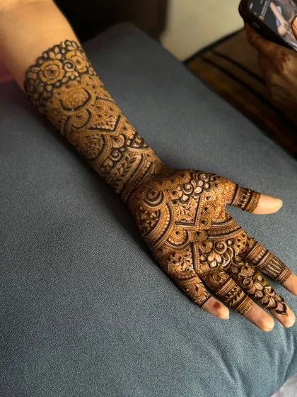 A full view of the palm and arm, demonstrating the complete coverage and artistry of this bridal henna.