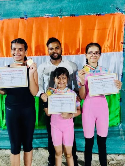 Gold medals for these three champions. I am so proud to stand with them as they show off their awards and certificates from a recent gymnastics competition.