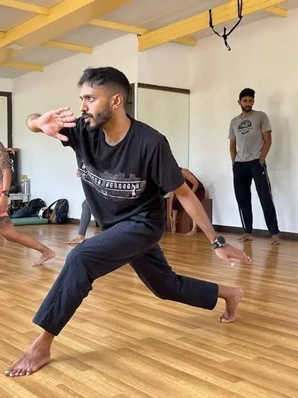 Here you can see the focus and energy during one of our workshops. We practice the foundational movements like the ginga, learning to stay low and ready for a playful exchange of kicks and escapes.