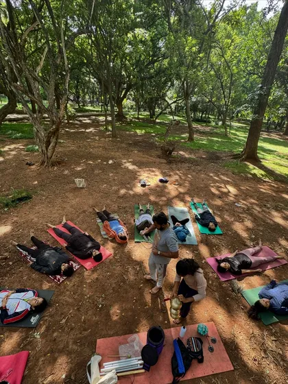 Our community often gathers in nature to connect and heal together. This image captures a beautiful moment from a sound healing session in a park, where participants lie in Savasana, absorbing the vibrations of the instruments and the earth.