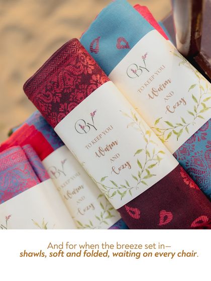 Soft shawls were folded and placed on every chair for when the evening breeze set in. This simple, considerate gesture ensured guests remained warm and comfortable throughout the outdoor celebration.