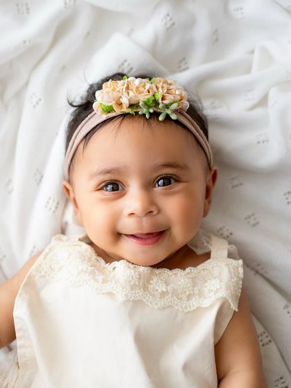 Those big, bright eyes and that sweet smile are what 6-month sessions are all about. I love capturing these simple, beautiful portraits.