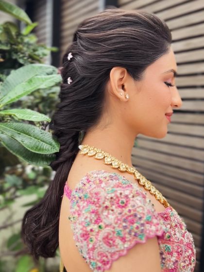 A side view of the textured pull-through braid, showing the volume at the crown and the softness of the style.