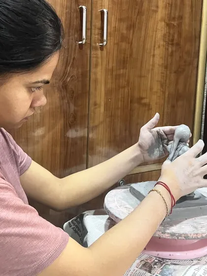 This is me working on a custom Ganesha idol at my wheel. The process is slow and requires a lot of focus, but it's how I ensure every handmade clay sculpture is unique and filled with devotion.