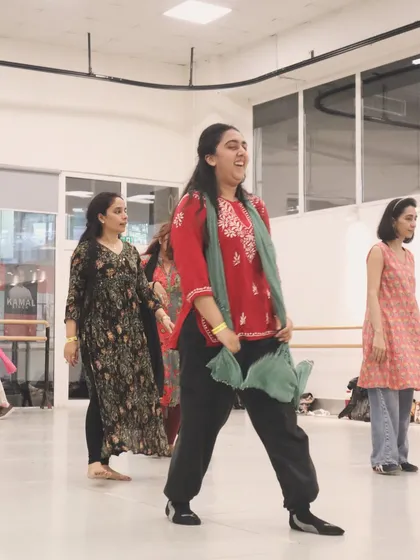 Happy faces during a Bollywood dance workshop. The joy of dancing to a song like 'Raanjhanaa' is clear to see.