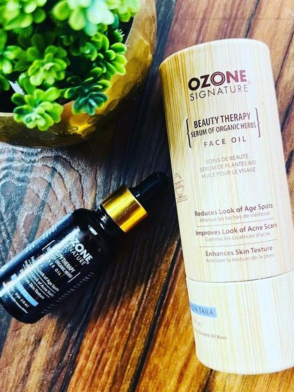 A flat-lay of the Ozone Signature Beauty Therapy Face Oil, showcasing its elegant, eco-friendly packaging and the potent serum inside.
