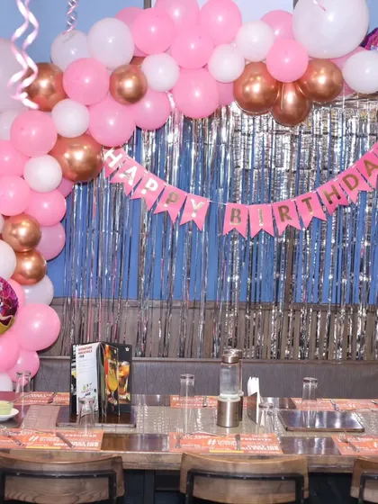 The 'Happy Birthday' banner and balloon details for the princess-themed decoration.