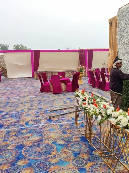 Here my team is setting up a floral wall for a wedding reception. This behind the scenes look shows the practical work that goes into building the beautiful backdrops for your event.