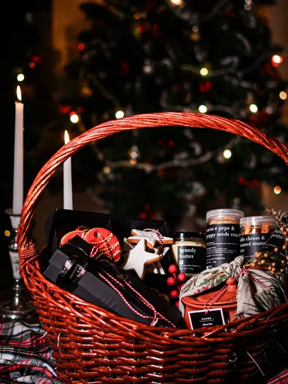 The warmth of Christmas, captured in a basket. This festive hamper is filled with holiday cheer, featuring our classic Christmas treats, pantry essentials like our brandy butter, and other gourmet surprises, all nestled in a rustic red wicker basket perfect for the season.