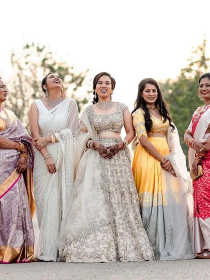A beautiful, candid moment of the women of the family sharing a genuine laugh together outdoors. We believe the best portraits happen when people forget the camera is even there.