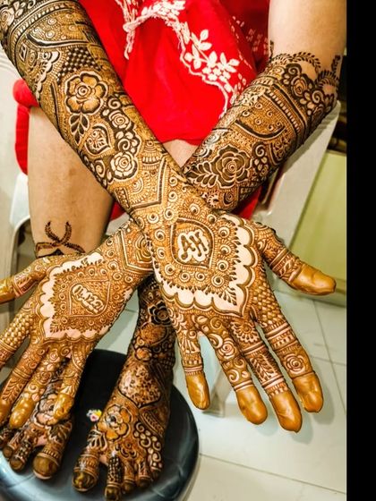 A personalized bridal design with the initials 'AH' and the name 'Hasan' beautifully incorporated.