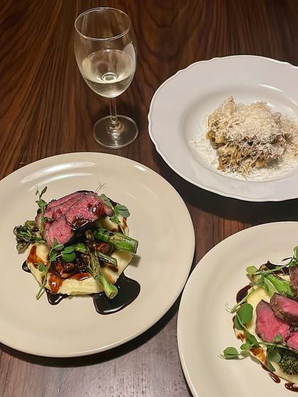 A hearty and elegant meal of New York Strip steak with pomme puree and torched broccolini, perfect for a steak and wine dinner.