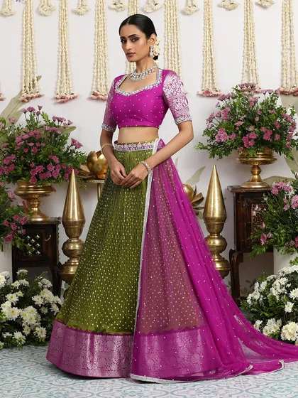 The full view of the olive green and magenta lehenga, a bold and beautiful choice for the fashion-forward bride.