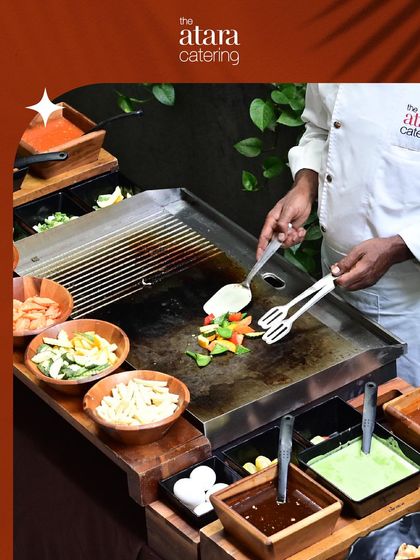 A chef preparing fresh ingredients at our Teppanyaki live station. We offer a wide array of vegetables and sauces for a fully customized meal.