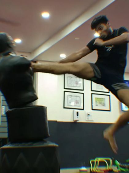 The follow-through of a flying kick shows the full extension and impact. We teach you to master your body and push your physical limits.